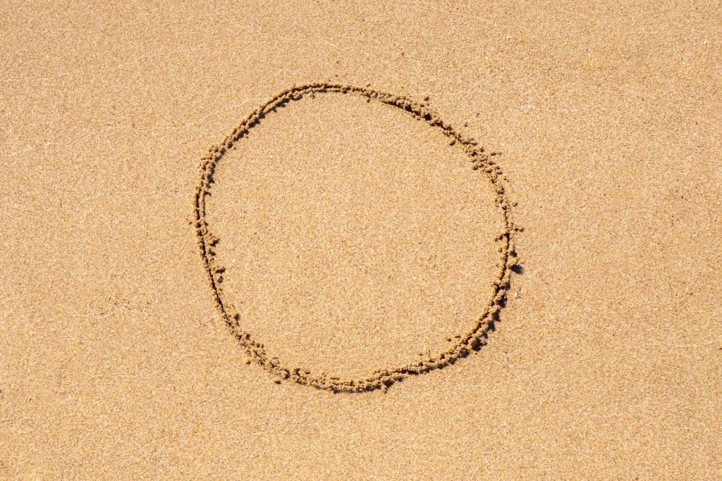 Target on beach sand