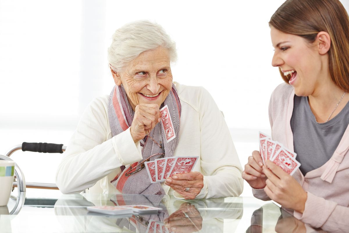 grandma playing cards with a mischievous look